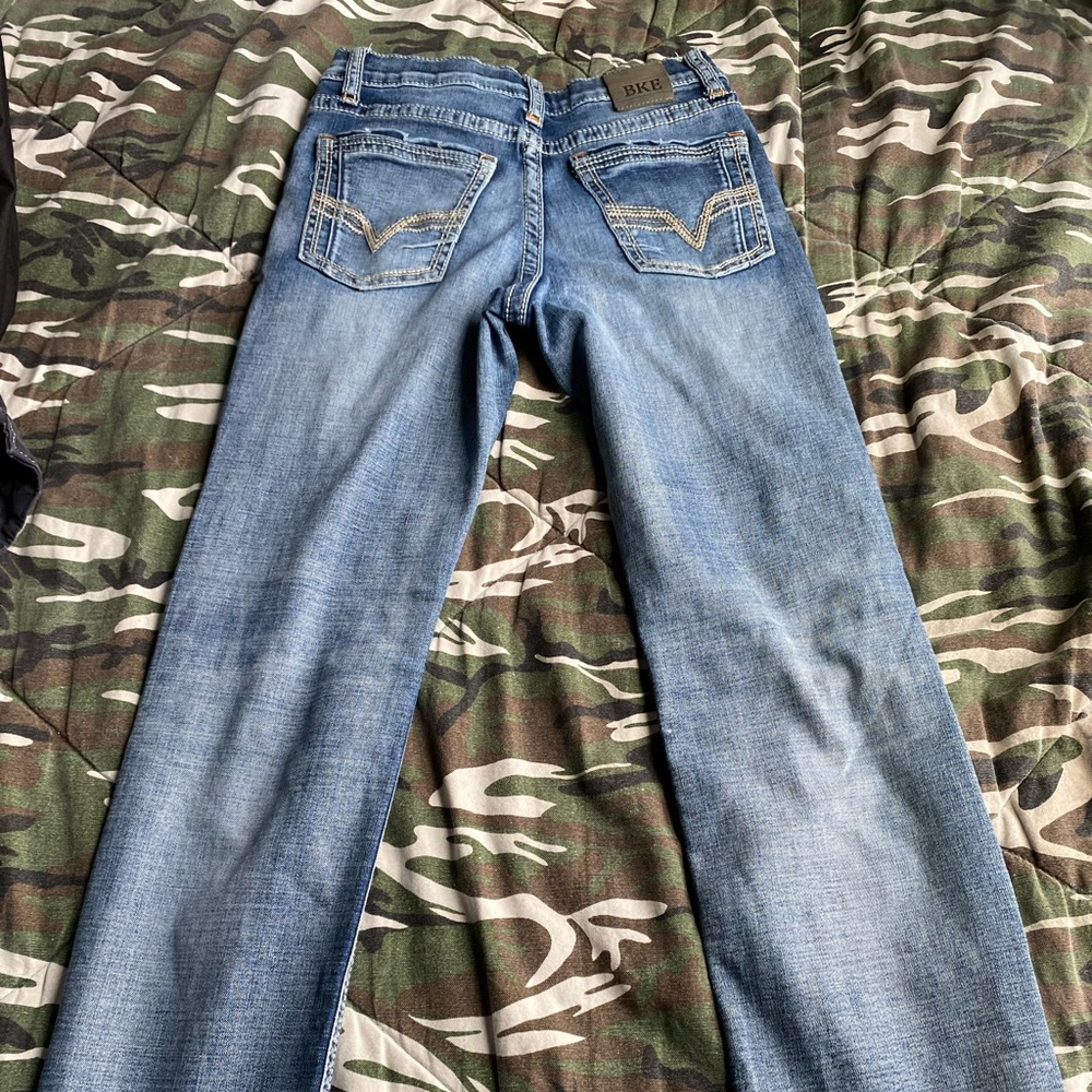 Slim leg buckle jeans size 14